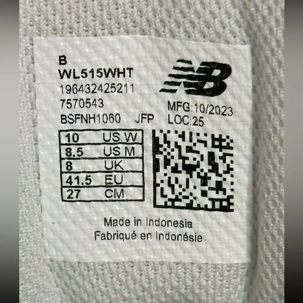 New Balance Grey / White athletic sneakers.
